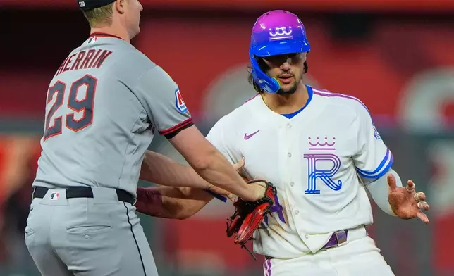 Kansas City Royals' Jac Caglianone is tagged out off base by Cleveland Guardians pitcher Tim Herrin as he tried to advance on a single by Maikel Garcia during the fourth inning of a baseball game Friday, Sept. 25, 2026, in Kansas City, Mo. (AP Photo/Charlie Riedel)
