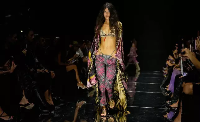 A model wears a creation part of the Roberto Cavalli women's Spring-Summer 2027 collection, presented in Milan, Italy, Thursday, Sept. 24, 2026. (AP Photo/Luca Bruno).