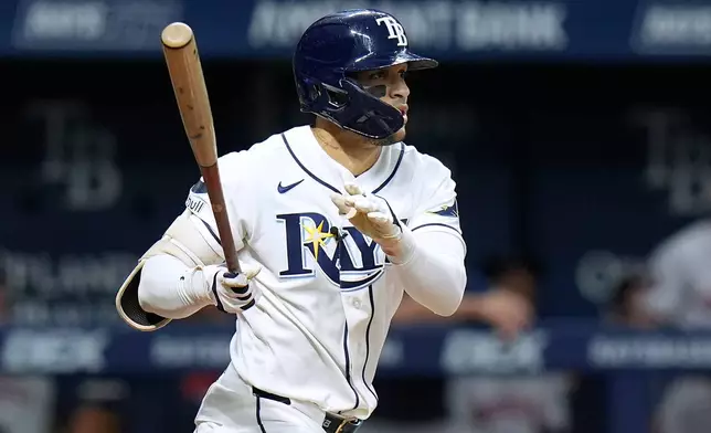 Tampa Bay Rays' Victor Mesa Jr. watches his single off Houston Astros pitcher Peter Lambert during the fifth inning of a baseball game Saturday, Sept. 12, 2026, in St. Petersburg, Fla. (AP Photo/Chris O'Meara)
