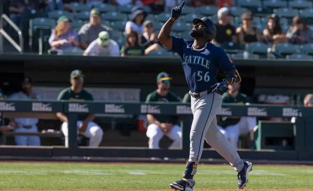 Seattle Mariners' Randy Arozarena runs the bases after hitting a home run during the eighth inning of a baseball game against the Athletics, Sunday, Sept. 13, 2026, in West Sacramento, Calif. (AP Photo/Sara Nevis)