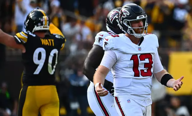 Atlanta Falcons quarterback Cooper Rush (13) reacts after a sack during an NFL football game against the Pittsburgh Steelers, Sunday, Sept. 13, 2026, in Pittsburgh. (AP Photo/Justin Berl)