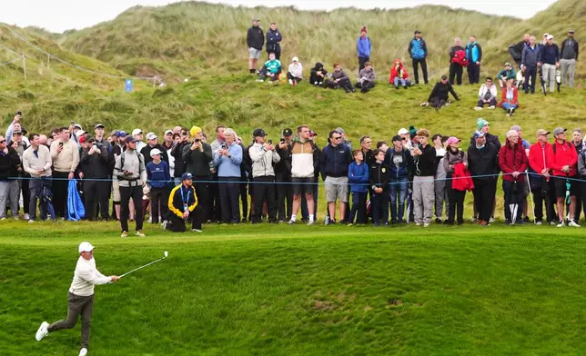 Rory McIlroy, of Northern Ireland, plays from rough on the fourth hole during the first round of the Irish Open golf tournament, Thursday, Sept. 10, 2026, in Doonbeg, Ireland. (Brian Lawless/PA via AP)