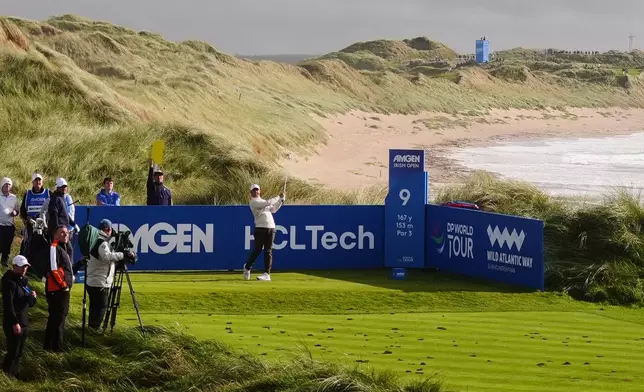 Rory McIlroy, of Northern Ireland, hits from the ninth tee during the first round of the Irish Open golf tournament, Thursday, Sept. 10, 2026, in Doonbeg, Ireland. (Brian Lawless/PA via AP)