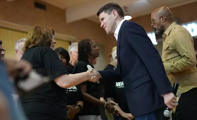 Democratic U.S. Senate candidate Texas state Rep. James Talarico talks with volunteers at a food drive at the Frederick Douglass Human Services and Justice Center, Wednesday, Sept. 9, 2026, in Dallas. (AP Photo/Julia Demaree Nikhinson)