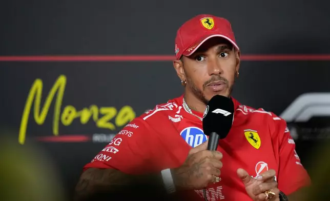 Ferrari driver Lewis Hamilton of Britain gestures during a news conference ahead of Sunday's Italy Grand Prix, at the Monza racetrack, Italy, Thursday, Sept. 3, 2026. (AP Photo/Luca Bruno)