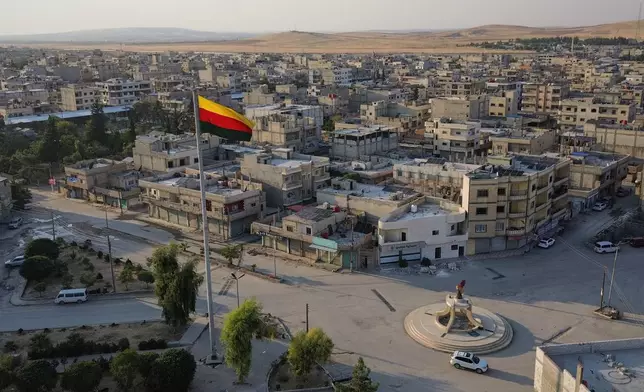 A Kurdish flag flies over central Kobani, northern Syria, Sunday, Sept. 13, 2026.(AP Photo/Baderkhan Ahmad)