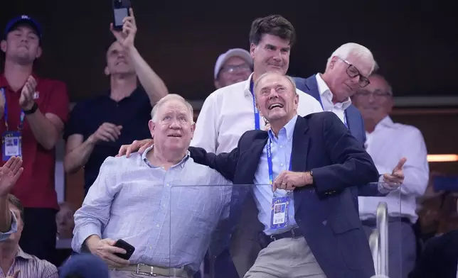 Dick Gould, front right, a 17-time champion coach at Stanford, looks on as he is honored at the U.S. Open tennis championships, Saturday, Sept. 5, 2026, in New York. (AP Photo/Frank Franklin II)