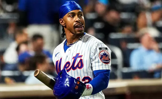 New York Mets Francisco Lindor (12) reacts after being called out during the fifth inning of a baseball game against the Baltimore Orioles, Wednesday, Sept. 16, 2026, in New York. (AP Photo/Eduardo Munoz Alvarez)