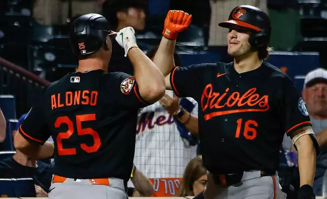 Baltimore Orioles Pete Alonso (25) celebrates a solo home run with his teammate Coby Mayo (16) during the first inning of a baseball game against the New York Mets, Wednesday, Sept. 16, 2026, in New York. (AP Photo/Eduardo Munoz Alvarez)