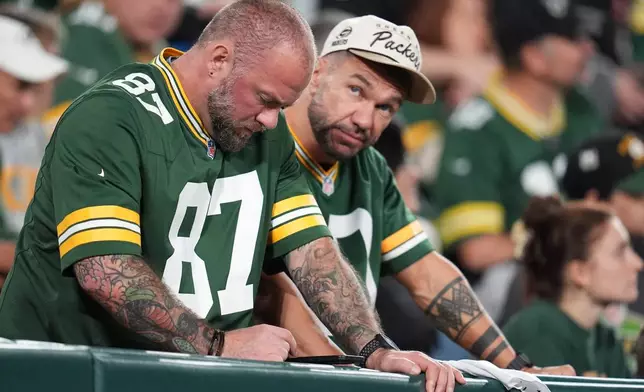 Green Bay Packers fans react during the second half of an NFL football game against the Atlanta Falcons in Green Bay, Wis., Thursday, Sept. 24, 2026. (AP Photo/Abbie Parr)