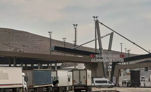 Trucks queue at the Gurbulak border crossing on the Turkish-Iranian border in Agri province, eastern Turkey, Tuesday, Sept. 22, 2026. (AP Photo/Serra Yedikardes)