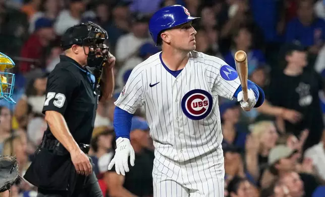 Chicago Cubs' Alex Bregman, right, watches his solo home run during the fourth inning of a baseball game against the Milwaukee Brewers in Chicago, Monday, Aug. 31, 2026. (AP Photo/Nam Y. Huh)