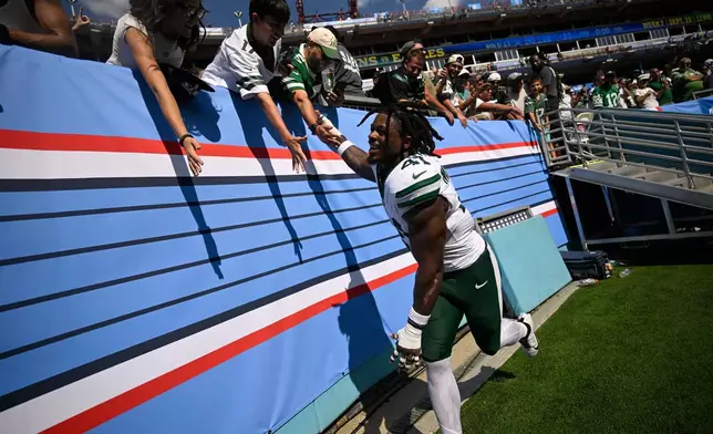 New York Jets linebacker Marcelino McCrary-Ball (41) greets fans at the end of an NFL football game against the New York Jets, Sunday, Sept. 13, 2026, in Nashville, Tenn. (AP Photo/John Amis)