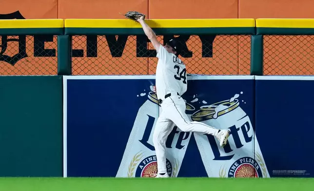 Detroit Tigers left fielder Brett Callahan (34) catches a Minnesota Twins' Ryan Jeffers fly ball during the sixth inning of a baseball game Tuesday, Sept. 8, 2026, in Detroit. (AP Photo/Paul Sancya)