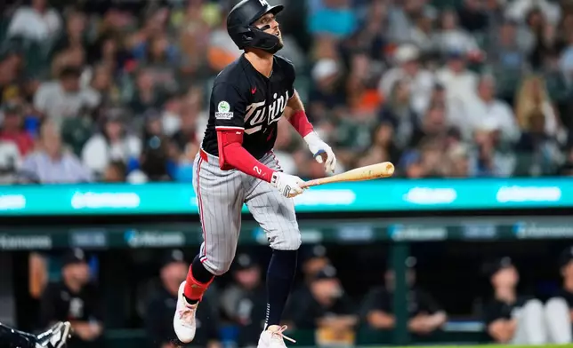 Minnesota Twins' Kody Clemens hits a two-run home run against the Detroit Tigers during the sixth inning of a baseball game Tuesday, Sept. 8, 2026, in Detroit. (AP Photo/Paul Sancya)