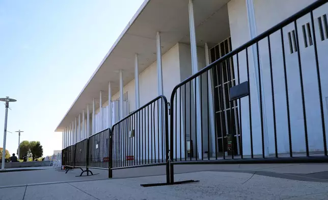 Fencing is installed at the John F. Kennedy Center for the Performing Arts, Wednesday, Sept. 16, 2026, in Washington. (AP Photo/Rahmat Gul)