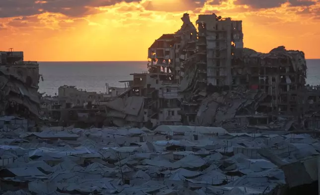 Tents sheltering displaced Palestinians are seen amid war-damaged buildings in Gaza City, Wednesday, Sept. 23, 2026. (AP Photo/Jehad Alshrafi)