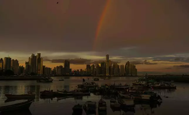 A rainbow arcs across the sky over Panama City at sunset, Tuesday, Sept. 22, 2026. (AP Photo/Matias Delacroix)
