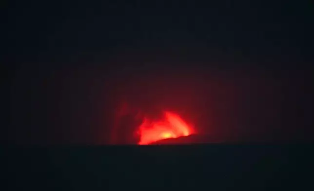 In this image released by Indonesia's Center for Volcanology and Geological Disaster Mitigation Agency (PVMBG), lava glows during the eruption of Mount Anak Krakatau in Sunda Strait, Indonesia, Saturday, Sept. 5, 2026. (PVMBG via AP)