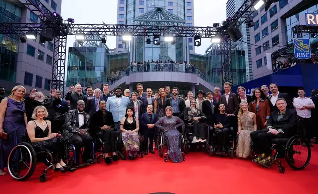Cast and crew arrive on the red carpet to promote the film Being Heumann at the Toronto International Film Festival, in Toronto, Thursday, Sept. 10, 2026. (Chris Young/The Canadian Press via AP)