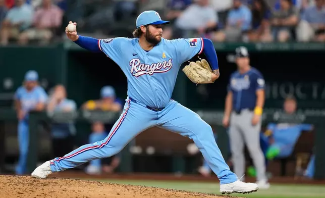Texas Rangers relief pitcher Trevor Williams throws to the Tampa Bay Rays during the fourth inning of a baseball game Sunday, Sept. 6, 2026, in Arlington, Texas. (AP Photo/Tony Gutierrez)
