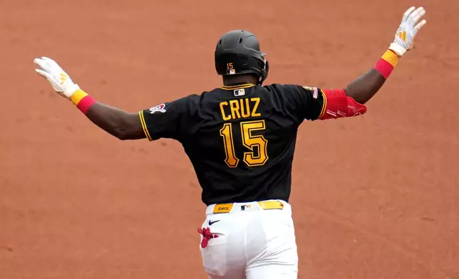 Pittsburgh Pirates' Oneil Cruz celebrates as he rounds first base after hitting a solo home run off Kansas City Royals pitcher Michael Wacha during the fourth inning of a baseball game in Pittsburgh, Sunday, Sept. 20, 2026. (AP Photo/Gene J. Puskar)
