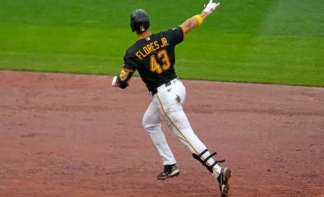 Pittsburgh Pirates' Rafael Flores Jr. rounds the bases after hitting a two-run home run off Kansas City Royals pitcher Nate Pearson during the eighth inning of a baseball game in Pittsburgh, Sunday, Sept. 20, 2026. (AP Photo/Gene J. Puskar)