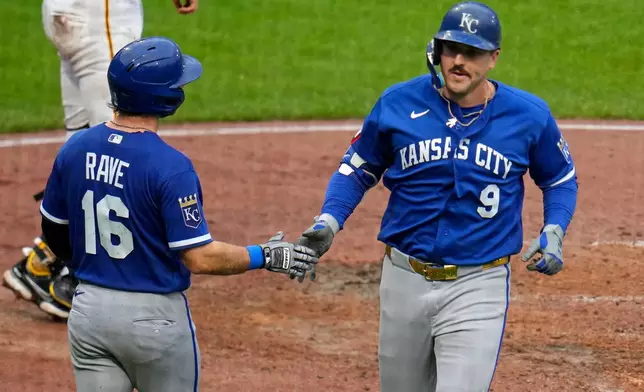 Kansas City Royals' Vinnie Pasquantino (9) celebrates with John Rave (16) as he heads to the dugout after hitting a two-run home run off Pittsburgh Pirates pitcher Carmen Mlodzinski during the seventh inning of a baseball game in Pittsburgh, Sunday, Sept. 20, 2026. (AP Photo/Gene J. Puskar)