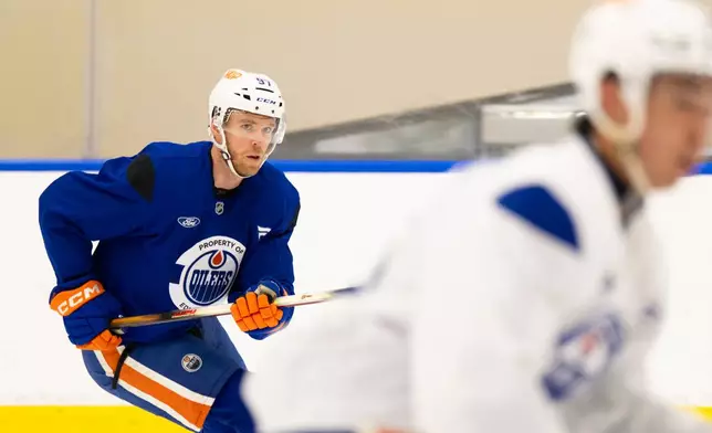 Edmonton Oilers' Connor McDavid skates during the NHL hockey team's training camp in Edmonton, Alberta, Thursday, Sept. 17, 2026. (John Ulan/The Canadian Press via AP)