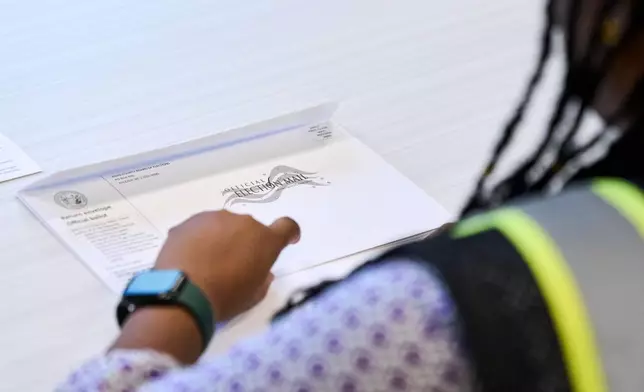 Wake County Board of Elections employees prepare absentee ballots to be mailed on Thursday, Sept. 3, 2026, in Raleigh, N.C. (AP Photo/Matt Ramey)