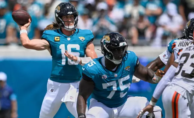 Jacksonville Jaguars quarterback Trevor Lawrence (16) passes in the first half of an NFL football game against the Cleveland Browns, Sunday, Sept. 13, 2026, in Jacksonville. (AP Photo/Phelan M. Ebenhack)