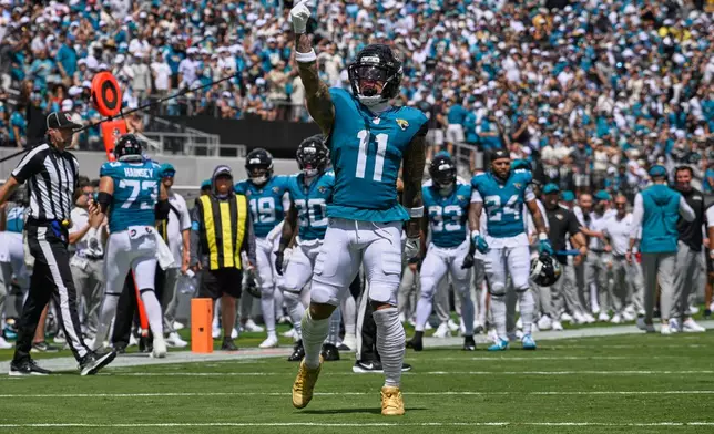 Jacksonville Jaguars cornerback Montaric Brown (1) celebrates his touchdown catch in the first half of an NFL football game against the Cleveland Browns, Sunday, Sept. 13, 2026, in Jacksonville. (AP Photo/Phelan M. Ebenhack)