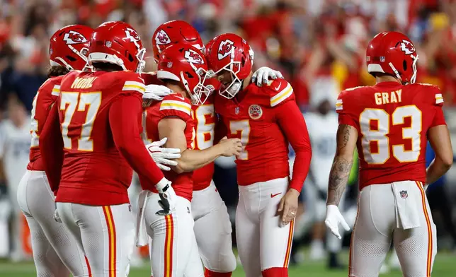 Kansas City Chiefs place kicker Harrison Butker (7) is congratulated by teammates after making a field goal to defeat the Indianapolis Colts in overtime of an NFL football game Sunday, Sept. 20, 2026, in Kansas City, Mo. during overtime of an NFL football game Sunday, Sept. 20, 2026, in Kansas City, Mo. (AP Photo/Colin E. Braley)