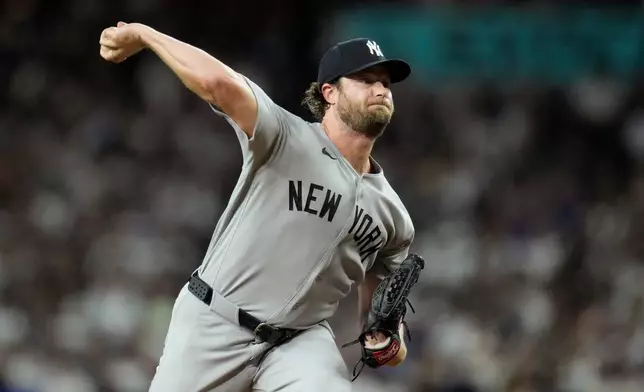 New York Yankees starting pitcher Gerrit Cole throws against the Arizona Diamondbacks during the first inning of a baseball game, Friday, Sept. 18, 2026, in Phoenix. (AP Photo/Ross D. Franklin)