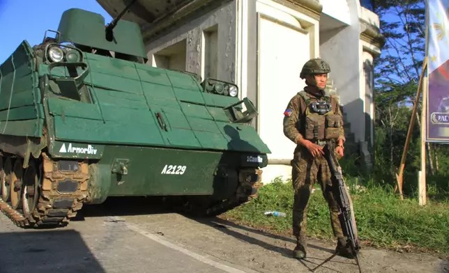 An armored personnel carrier stays at a checkpoint during the Bangsamoro Autonomous Region in Muslim Mindanao parliamentary elections at a school in Saguiaran, Lanao del Sur province, southern Philippines, Monday, Sept. 14, 2026. (AP Photo/Richel V.Umel)