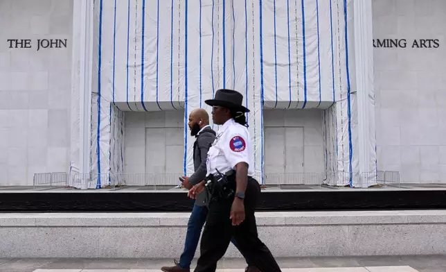 Security patrols the Kennedy Center, which has been fenced off and closed to the public, Thursday, Sept. 17, 2026, in Washington. (AP Photo/Jacquelyn Martin)