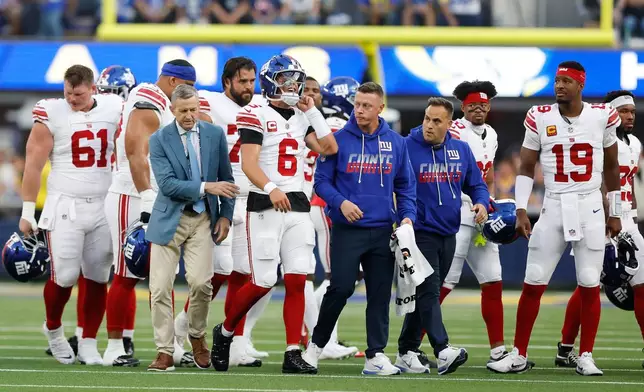 New York Giants quarterback Jaxson Dart (6) walks off the field with an injury during the first half of an NFL football game against the Los Angeles Rams in Inglewood, Calif., Monday, Sept. 21, 2026. (AP Photo/Caroline Brehman)