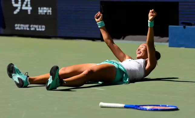 Qinwen Zheng, of China, celebrates after winning a match against Iga Swiatek, of Poland, during the fourth round of the U.S. Open tennis championships, Monday, Sept. 7, 2026, in New York. (AP Photo/Seth Wenig)