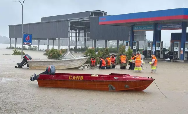 Vietnamese army troops prepare boats for rescue works in flooding areas in Thanh Hoa province, Vietnam, Thursday, Sept. 17, 2026. (Tran Van Hoang/VNA via AP)