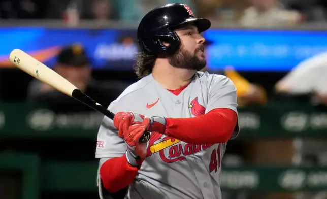 St. Louis Cardinals' Alec Burleson follows through on a single off Pittsburgh Pirates pitcher Brandon Eisert, driving in a run, during the third inning of a baseball game in Pittsburgh, Wednesday, Sept. 23, 2026. (AP Photo/Gene J. Puskar)