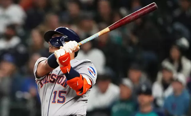 Houston Astros' Isaac Paredes follows through on a double against the Seattle Mariners during the first inningof a baseball game, Wednesday, Sept. 23, 2026, in Seattle. (AP Photo/Lindsey Wasson)