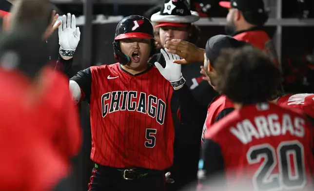 Chicago White Sox's Munetaka Murakami, of Japan, celebrates with teammates in the dugout after hitting a solo home run during the first inning of a baseball game against the Colorado Rockies Friday, Sept. 25, 2026, in Chicago. (AP Photo/Paul Beaty)