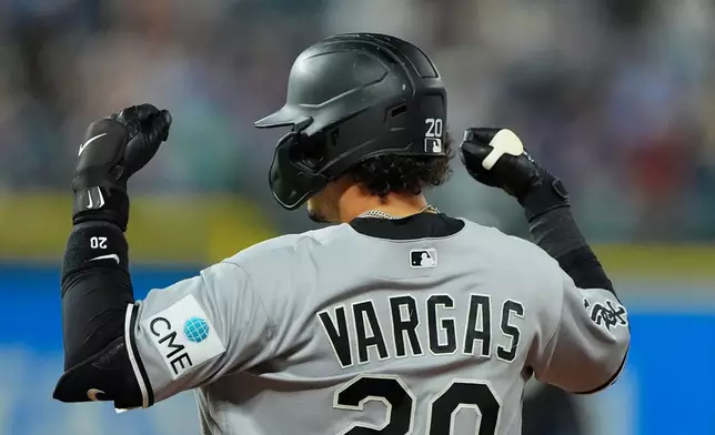 Chicago White Sox's Miguel Vargas celebrates on first after hitting an RBI single during the third inning of a baseball game against the Kansas City Royals, Wednesday, Sept. 23, 2026, in Kansas City, Mo. (AP Photo/Charlie Riedel)