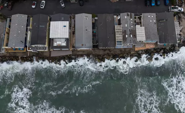 Oceanfront homes sit along the coastline near North Beach in San Clemente, Calif., Friday, Sept. 18, 2026. (AP Photo/Jae C. Hong)