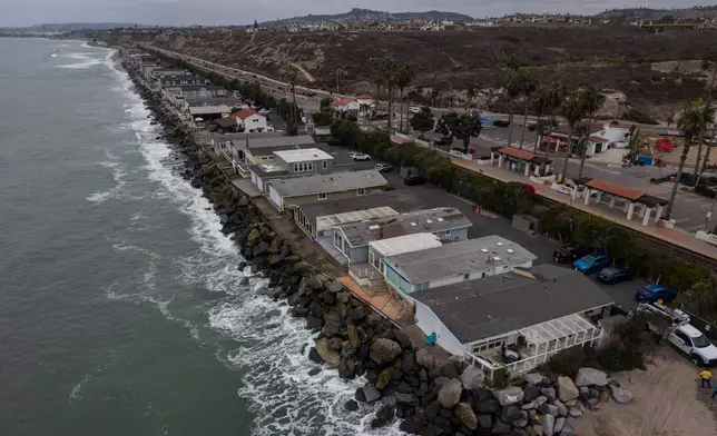 Oceanfront homes sit along the coastline near North Beach in San Clemente, Calif., Friday, Sept. 18, 2026. (AP Photo/Jae C. Hong)