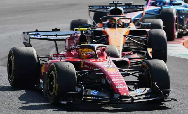 Ferrari driver Lewis Hamilton of Britain steers his car during the Italian Formula One Grand Prix race, in Monza, Italy, Sunday, Sept. 6, 2026. (AP Photo/Antonio Calanni)