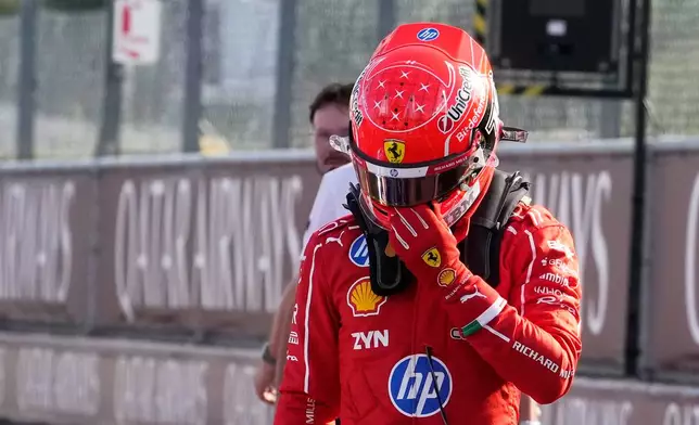 Ferrari driver Charles Leclerc of Monaco reacts after the qualifying session ahead of the Italian Formula One Grand Prix, in Monza, Italy, Saturday, Sept. 5, 2026. (AP Photo/Luca Bruno)