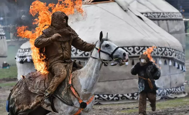 A participant shows his skills as he takes part in the horse-riding competition during the World Nomad Games in Kyrchyn Gorge, 240 km (150 miles) southeast of Bishkek, Kyrgyzstan, Wednesday, Sept. 2, 2026. (AP Photo/Vladimir Voronin)