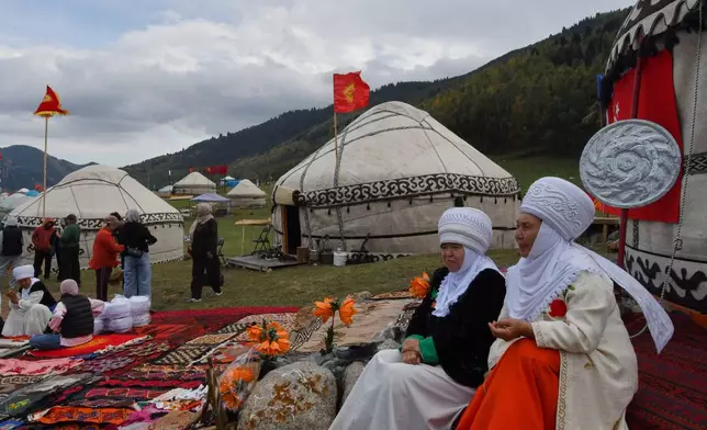 Kyrgyz women display their craftsmanship skills during at the World Nomad Games in Kyrchyn Gorge, 240 kilometers (150 miles) southeast of Bishkek, Kyrgyzstan, on Thursday, Sept. 3, 2026, with yurts in the background. (AP Photo/Vladimir Voronin)