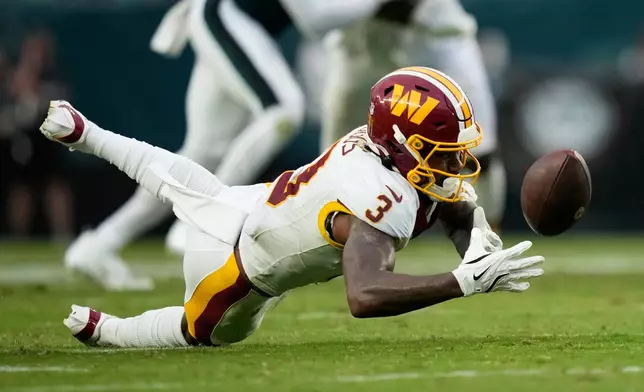 Washington Commanders wide receiver Stefon Diggs (3) fails to catch a pass during the second half of an NFL football game against the Philadelphia Eagles, Sunday, Sept. 13, 2026, in Philadelphia. (AP Photo/Matt Slocum)